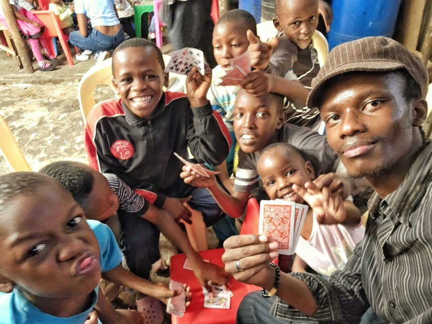 Children and volunteers laughing together