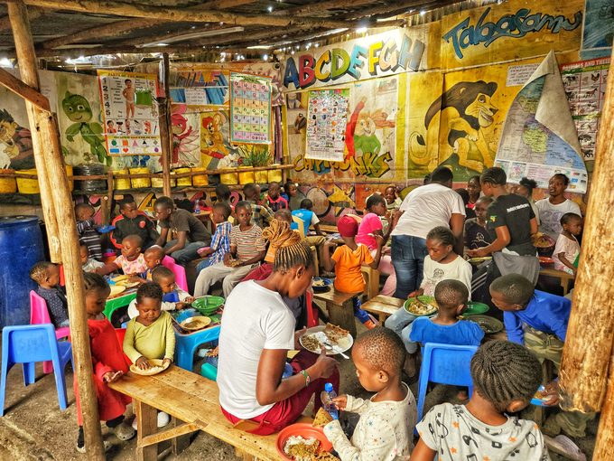 Children seated at tables during a shared meal